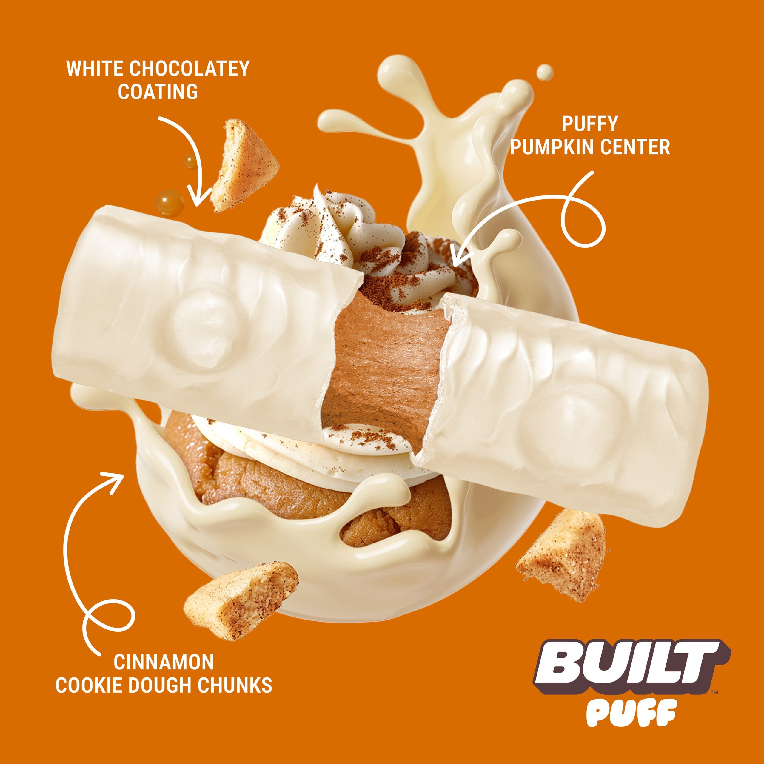 White chocolate coating splashing around pumpkin cookie dough chunks and cinnamon cookie pieces in the center
